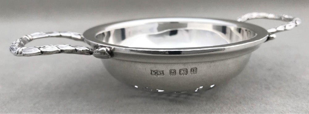 An attractive silver tea strainer View V