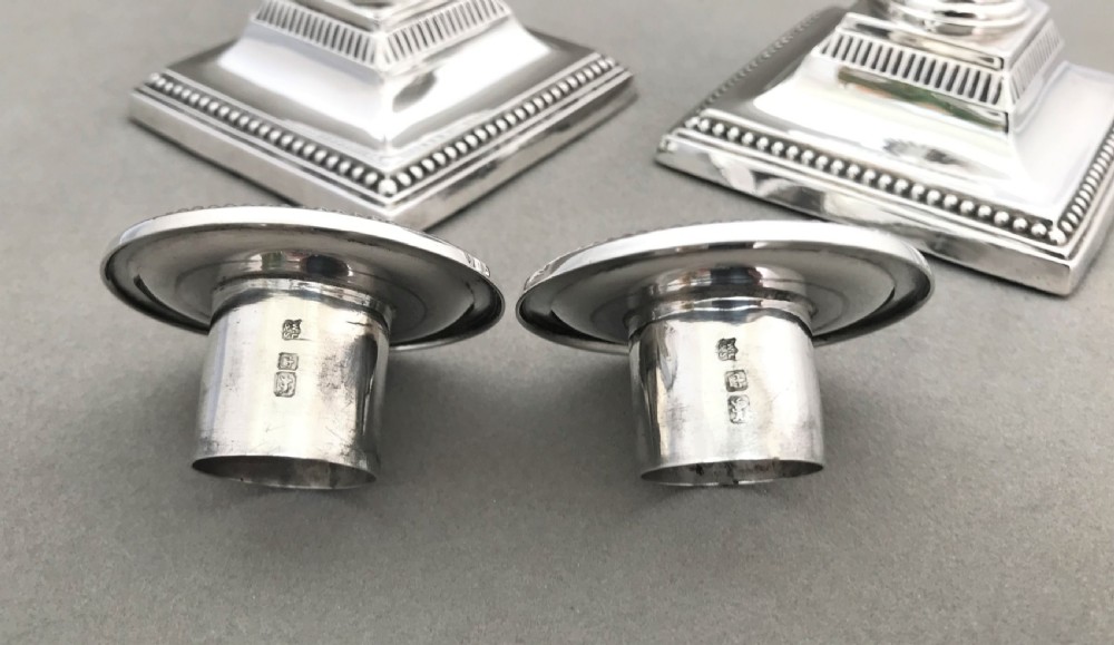 A superb pair of Edwardian half height silver candle sticks View VI