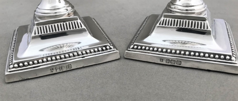 A superb pair of Edwardian half height silver candle sticks View VII