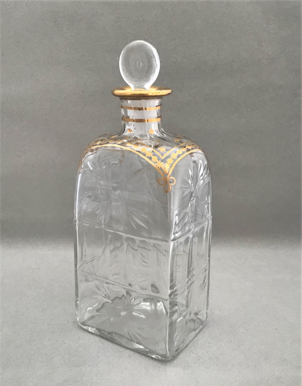 A gorgeous Georgian cut & gilded spirit decanter