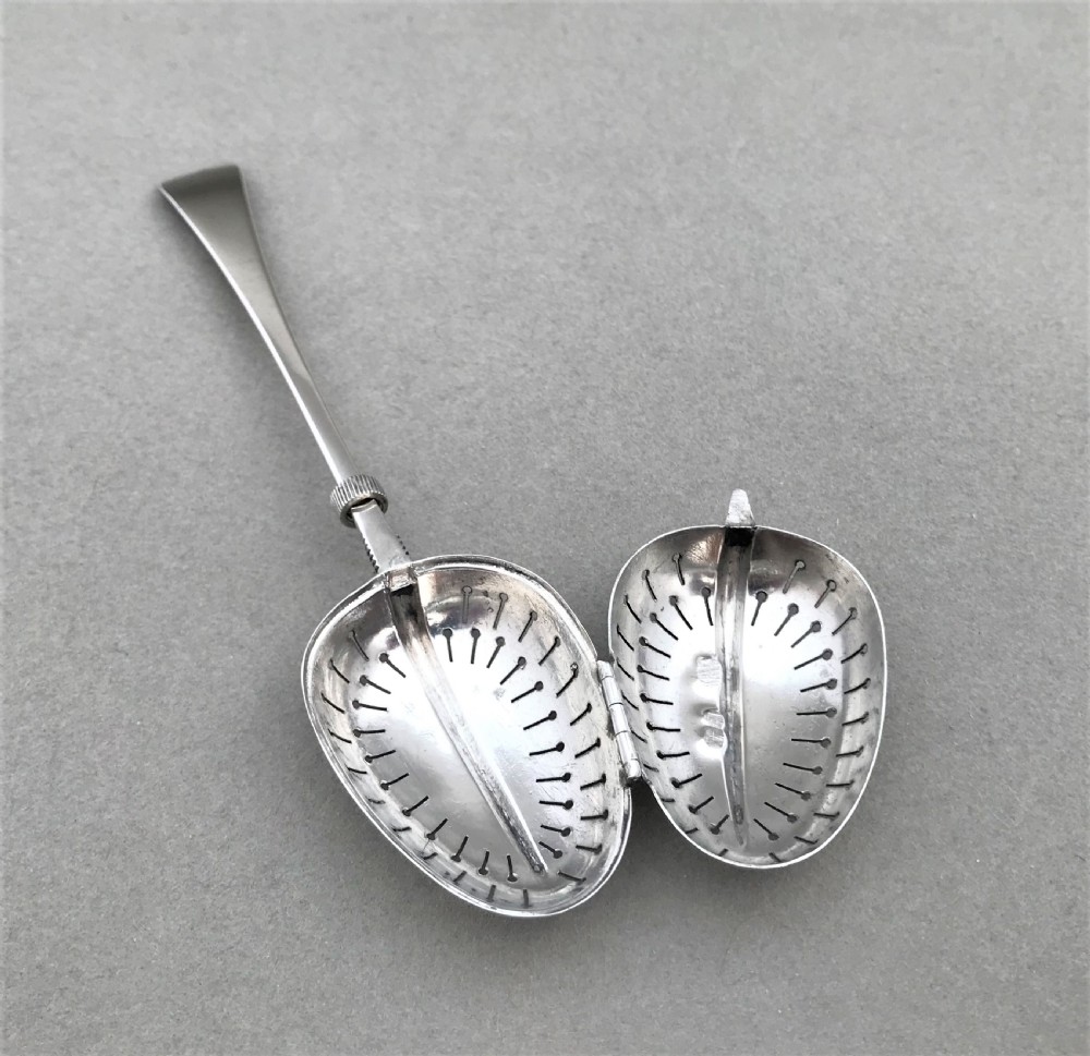 A rare Victorian silver tea infuser of patented design View V