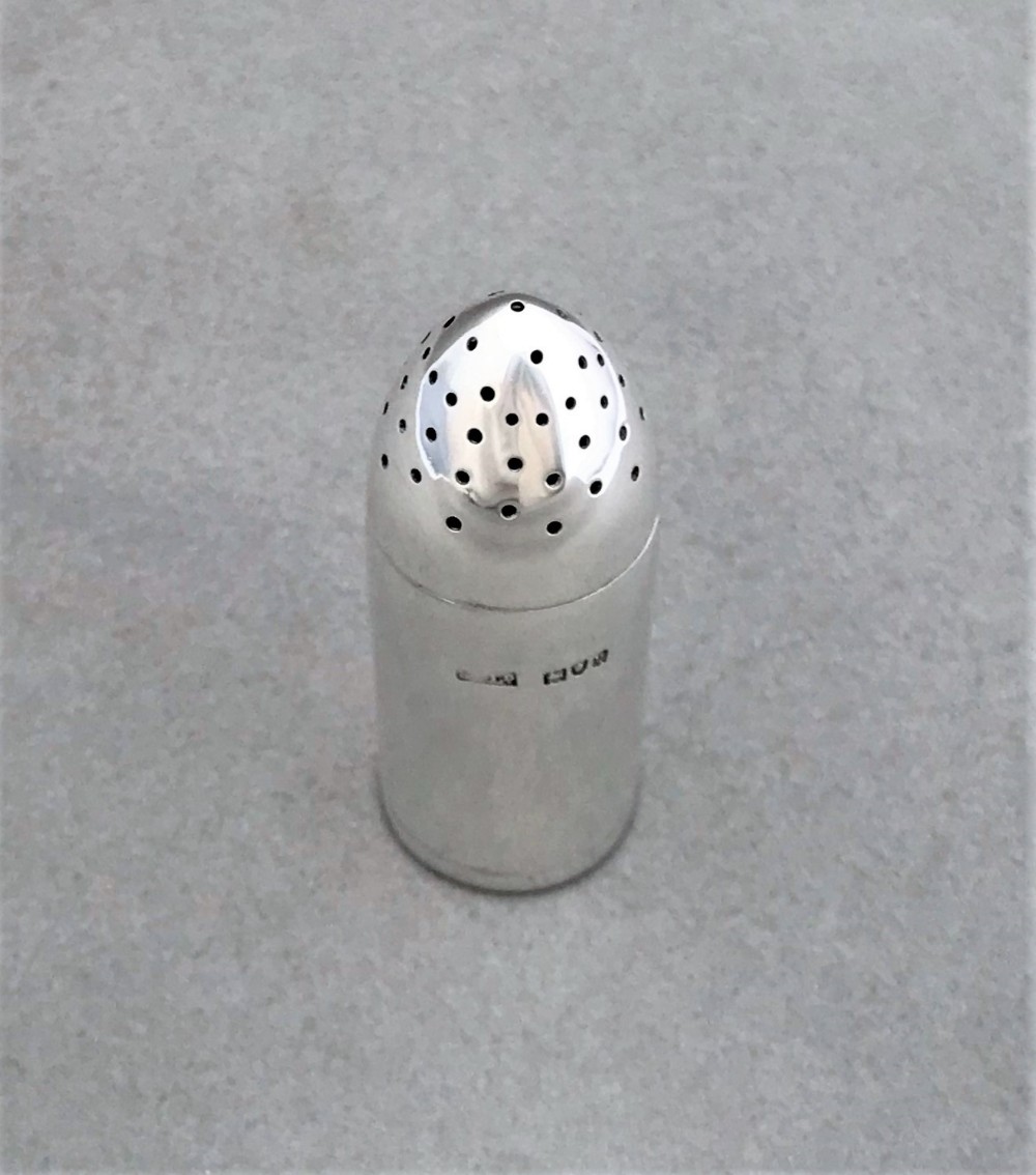 A rare novelty silver 'shell' pepper pot