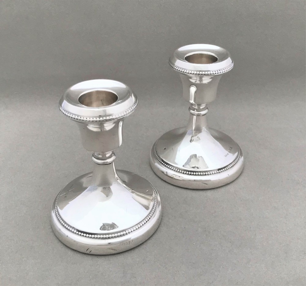 A good pair of dwarf silver candlesticks