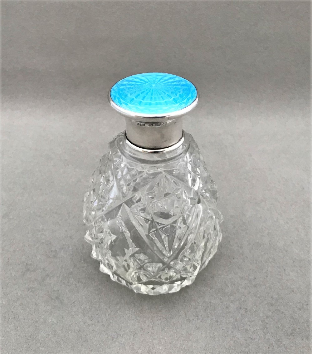 A gorgeous Art Deco small silver & enamel cologne bottle