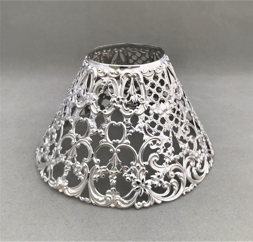 A fabulous pair of Sterling silver candle shades and sticks View V