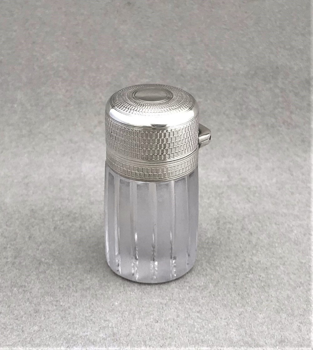 A gorgeous silver mounted scent bottle