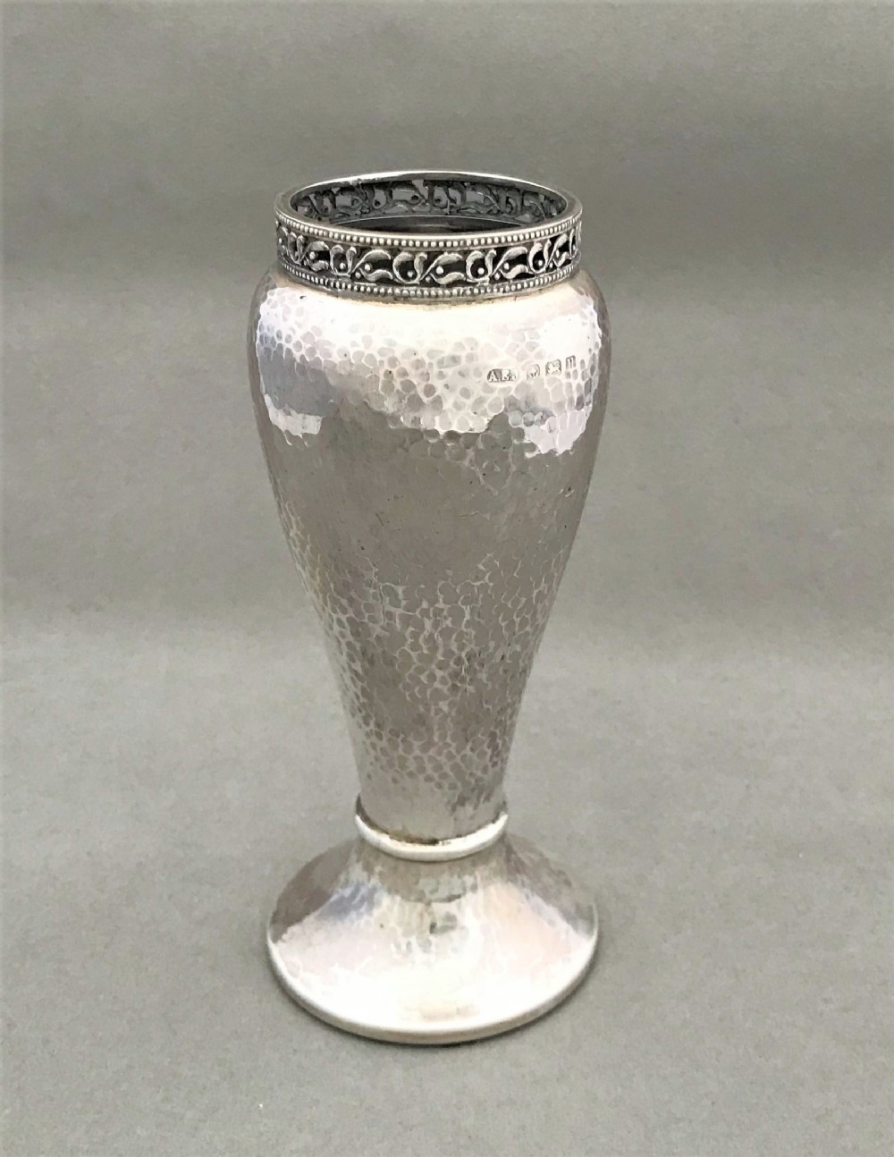 A fabulous A E Jones Arts & Crafts silver vase