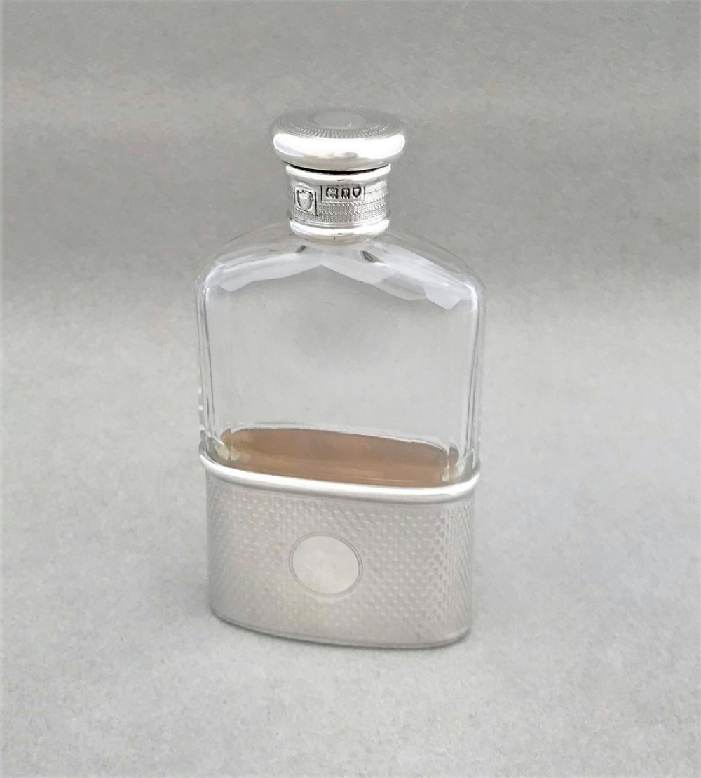 A gorgeous small silver mounted hip flask
