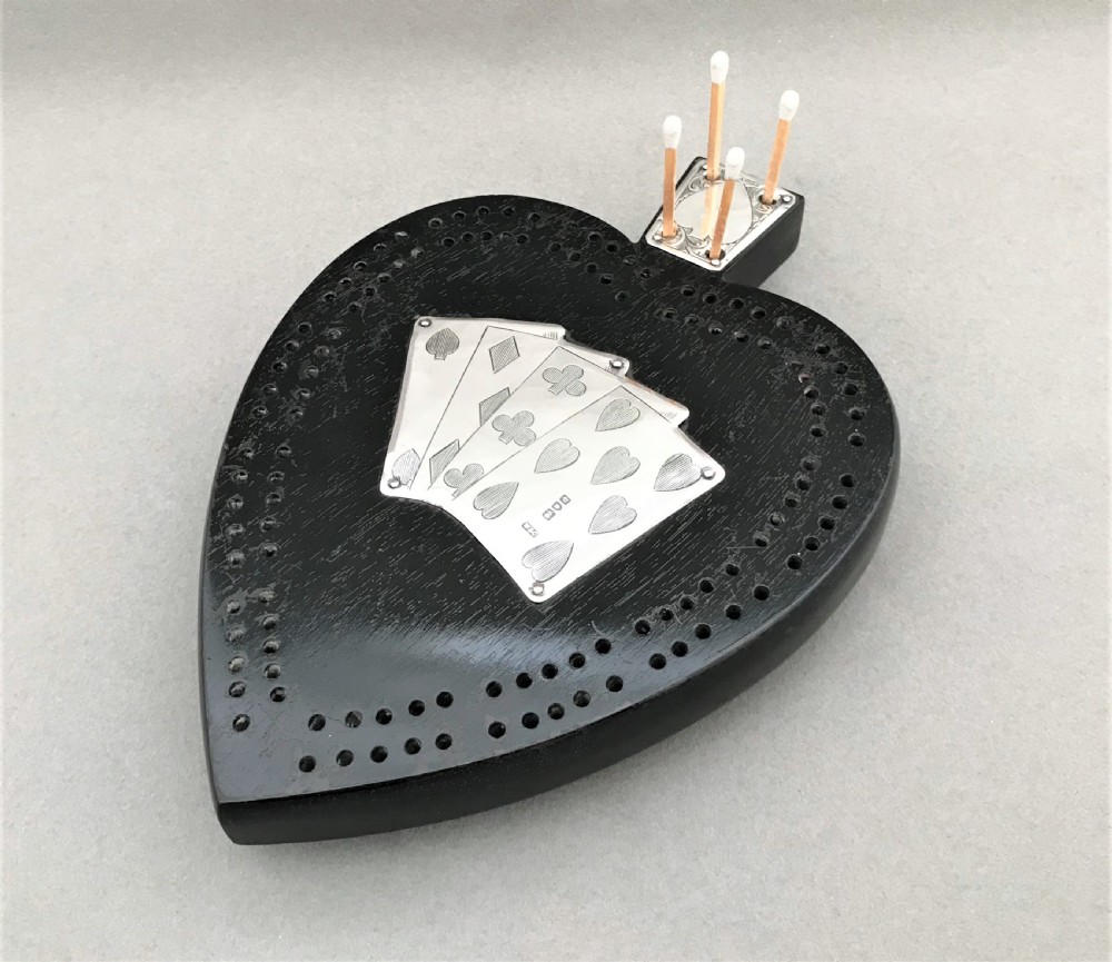 An outstanding Victorian silver mounted cribbage board