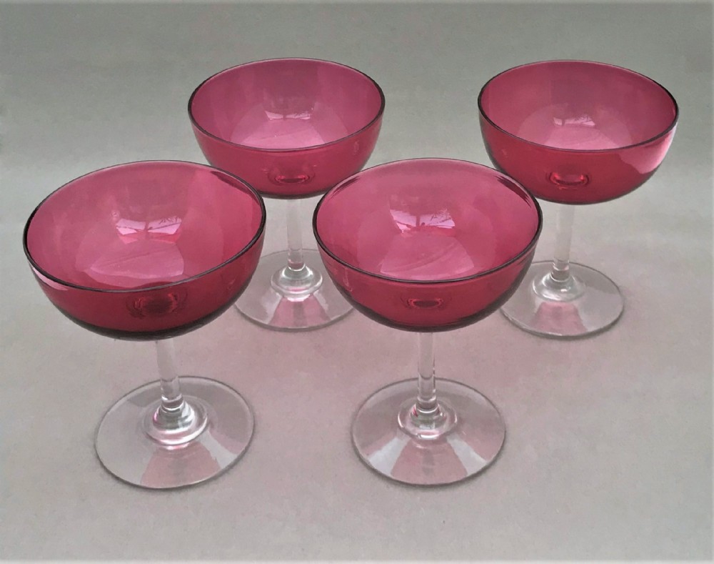 A superb set of 4 Victorian Cranberry champagne glasses