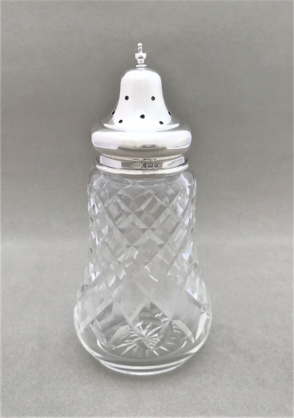 A lovely silver mounted sugar caster