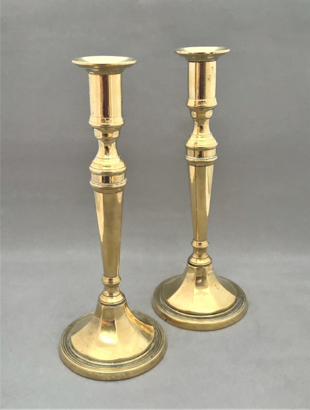 A fine pair of Victorian brass candlesticks