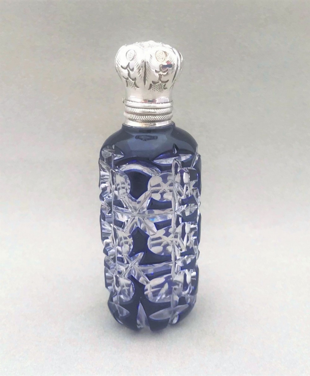 A gorgeous Victorian silver mounted overlay scent bottle
