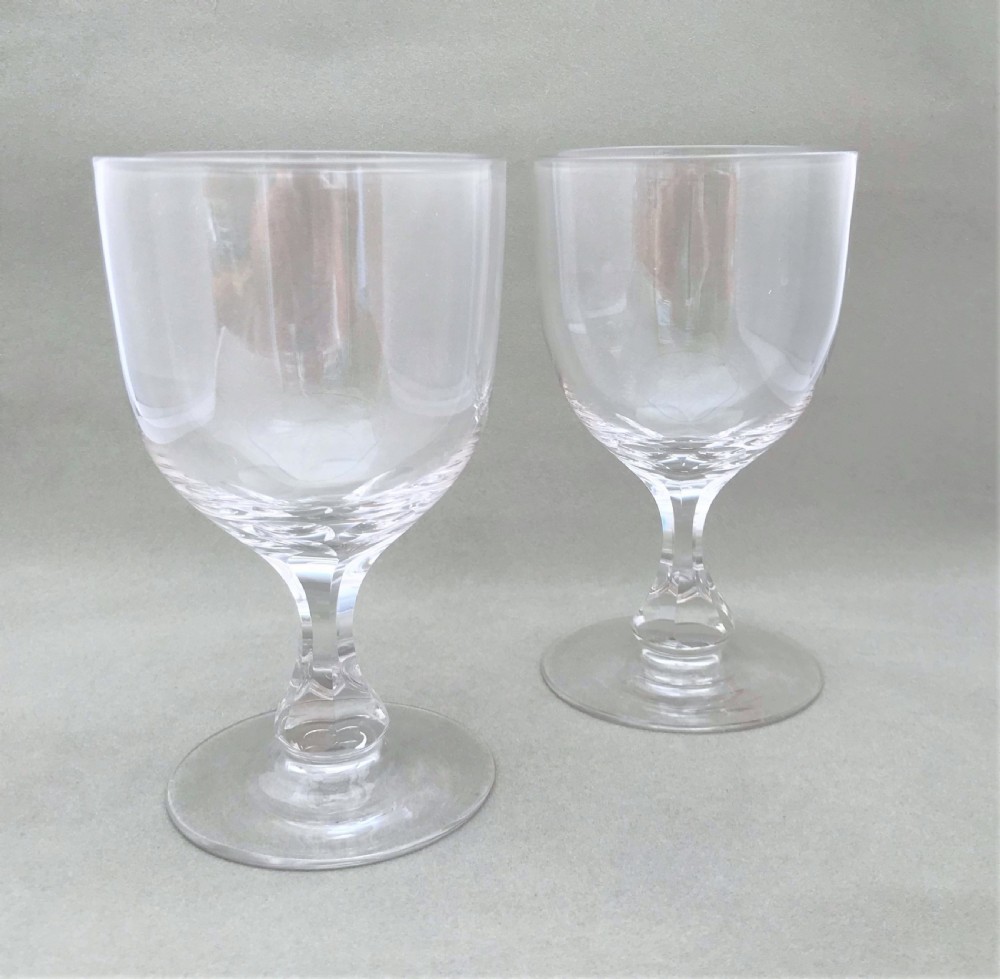 A large pair of Victorian cut glass wine goblets