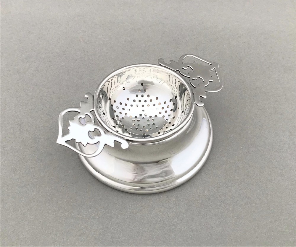 A lovely George VI silver tea strainer & cup