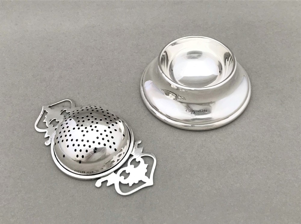 A lovely George VI silver tea strainer & cup View III