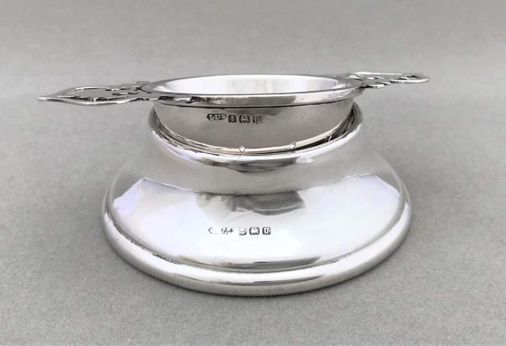 A lovely George VI silver tea strainer & cup View IV