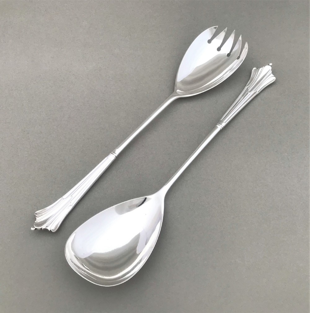 A superb pair of Victorian silver salad servers
