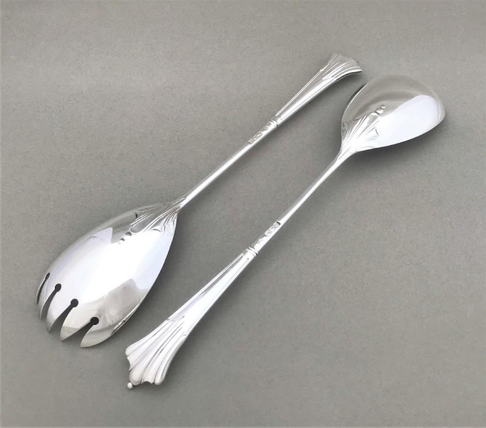 A superb pair of Victorian silver salad servers View II
