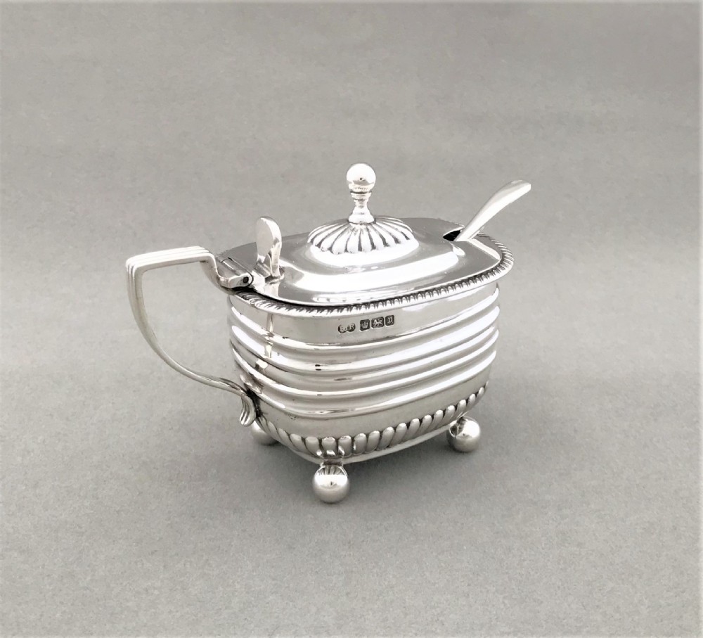 A handsome Edwardian silver mustard pot & spoon
