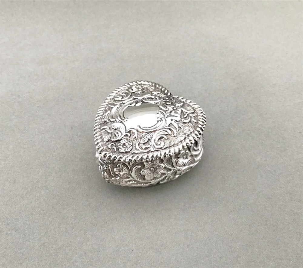 A large Victorian silver heart shaped pill box