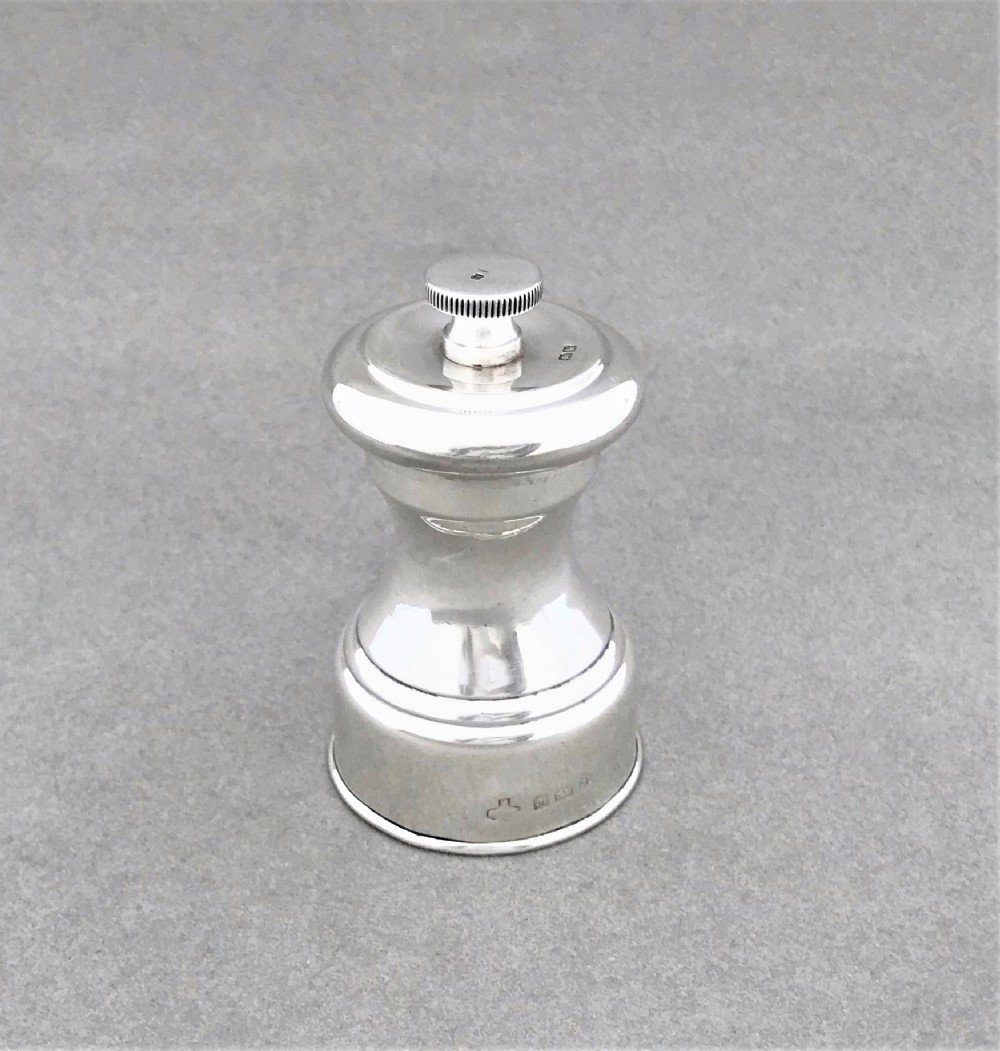 A handsome all silver pepper grinder