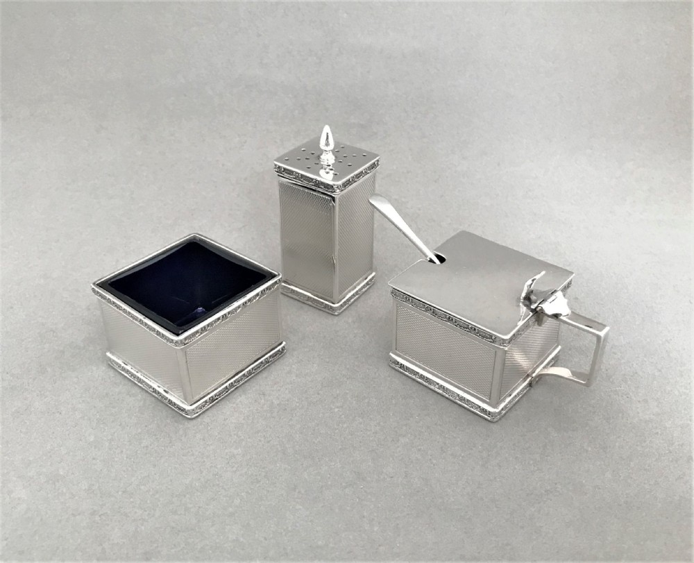 A stylish Art Deco silver three piece cruet