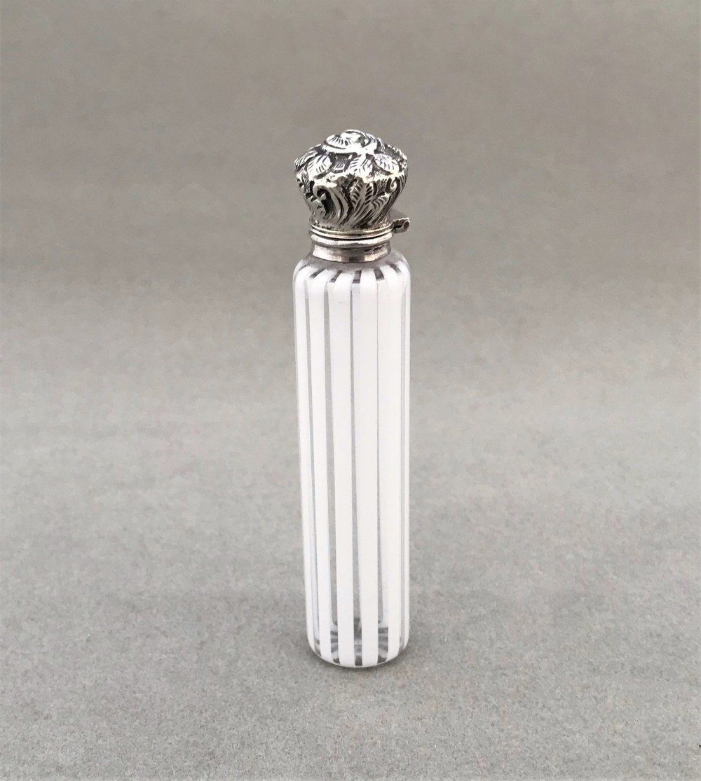 An exquisite Victorian silver mounted scent bottle