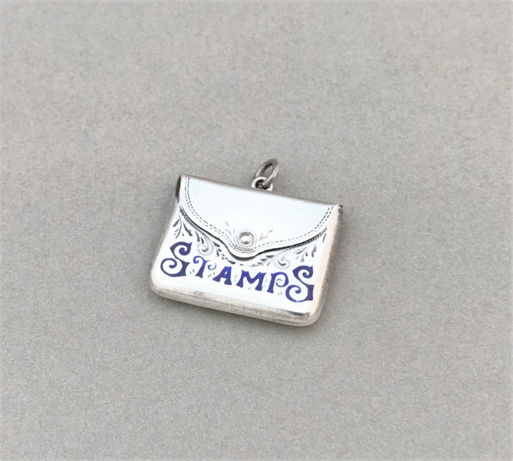 A gorgeous silver and enamel stamp envelope