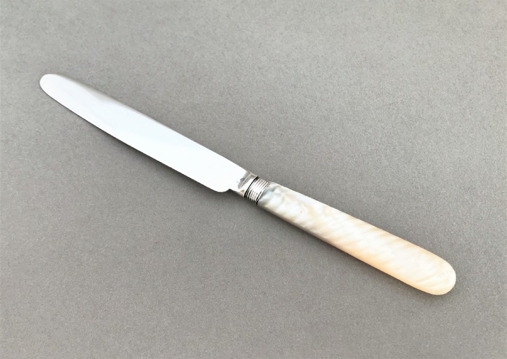 A stylish Georgian silver & mother-of-peal butter knife View II