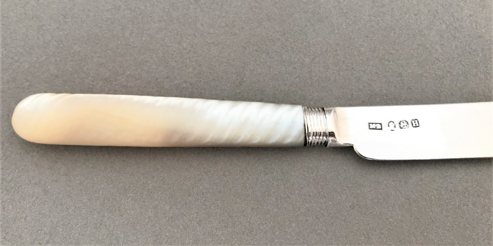 A stylish Georgian silver & mother-of-peal butter knife View III