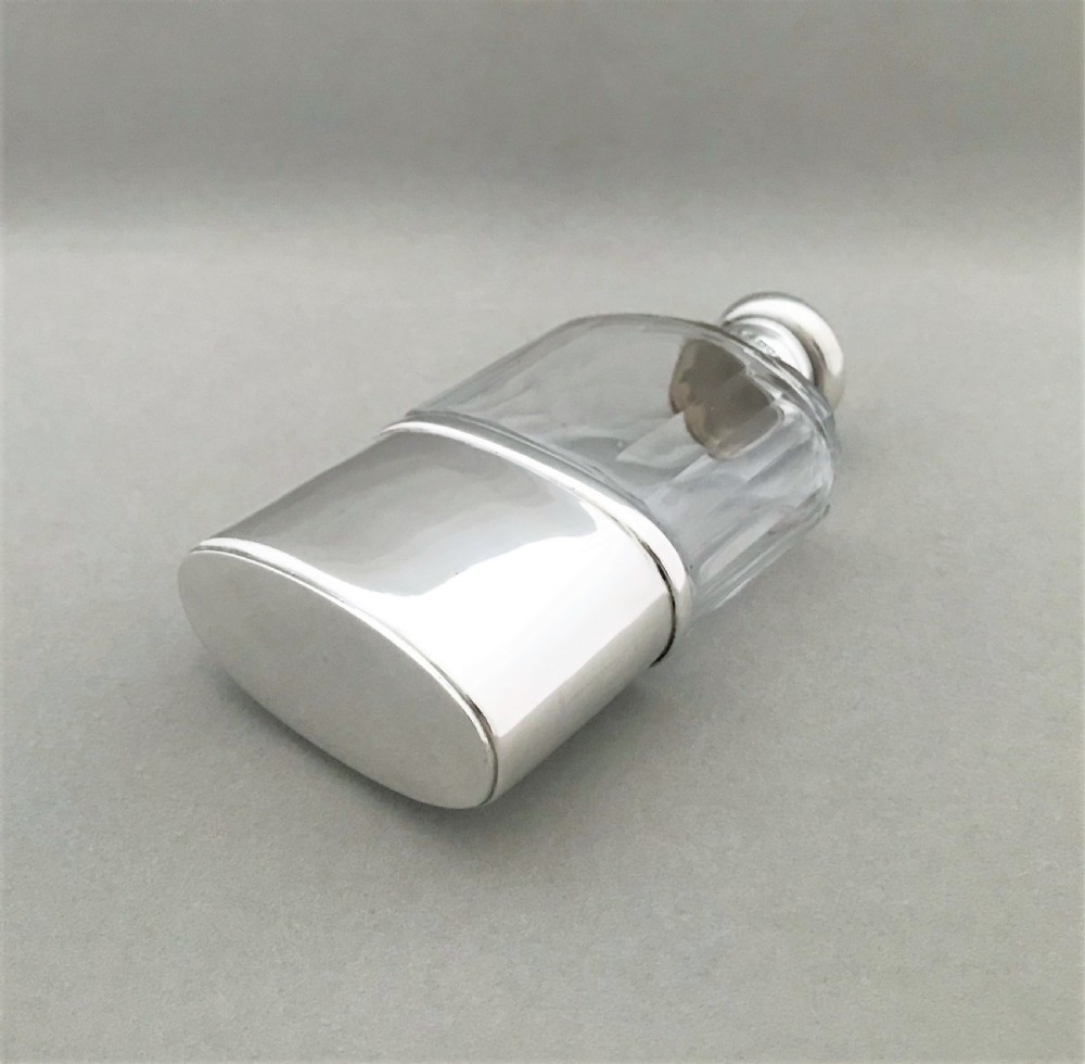 A handsome George V silver & glass hip flask View VI