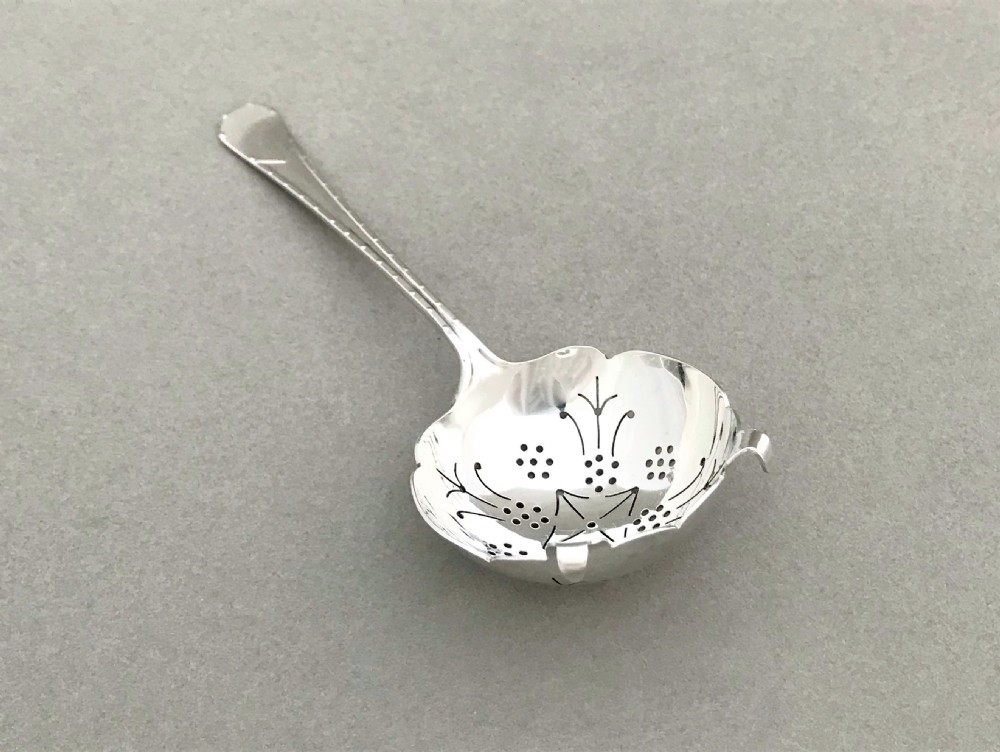 An Art Deco period silver tea strainer View IV