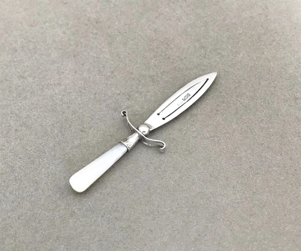 A delightful silver & mother-of pearl dagger bookmark