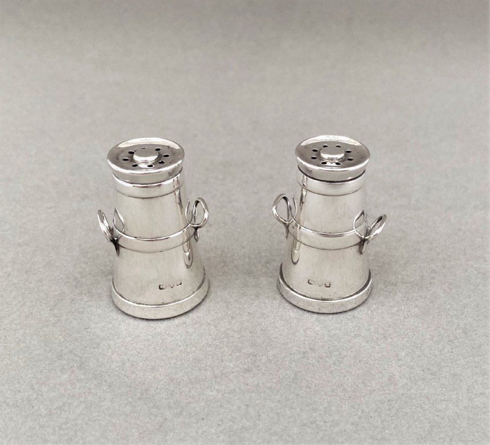 A pair of Chester silver novelty Edwardian pepperettes