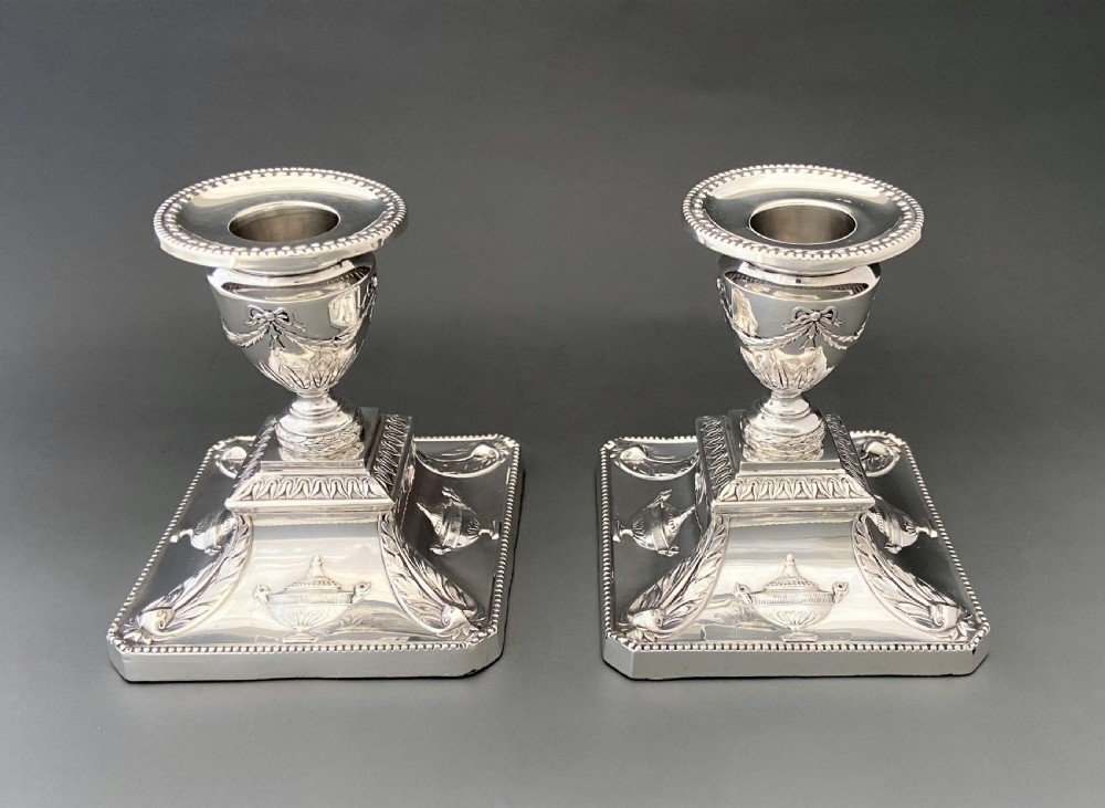 A superb pair of Edwardian silver candlesticks View II