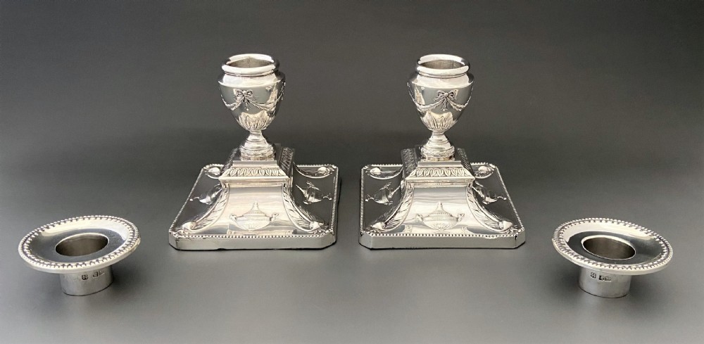 A superb pair of Edwardian silver candlesticks View III