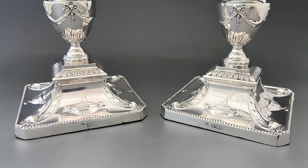 A superb pair of Edwardian silver candlesticks View V