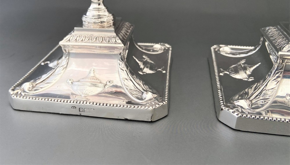 A superb pair of Edwardian silver candlesticks View VI