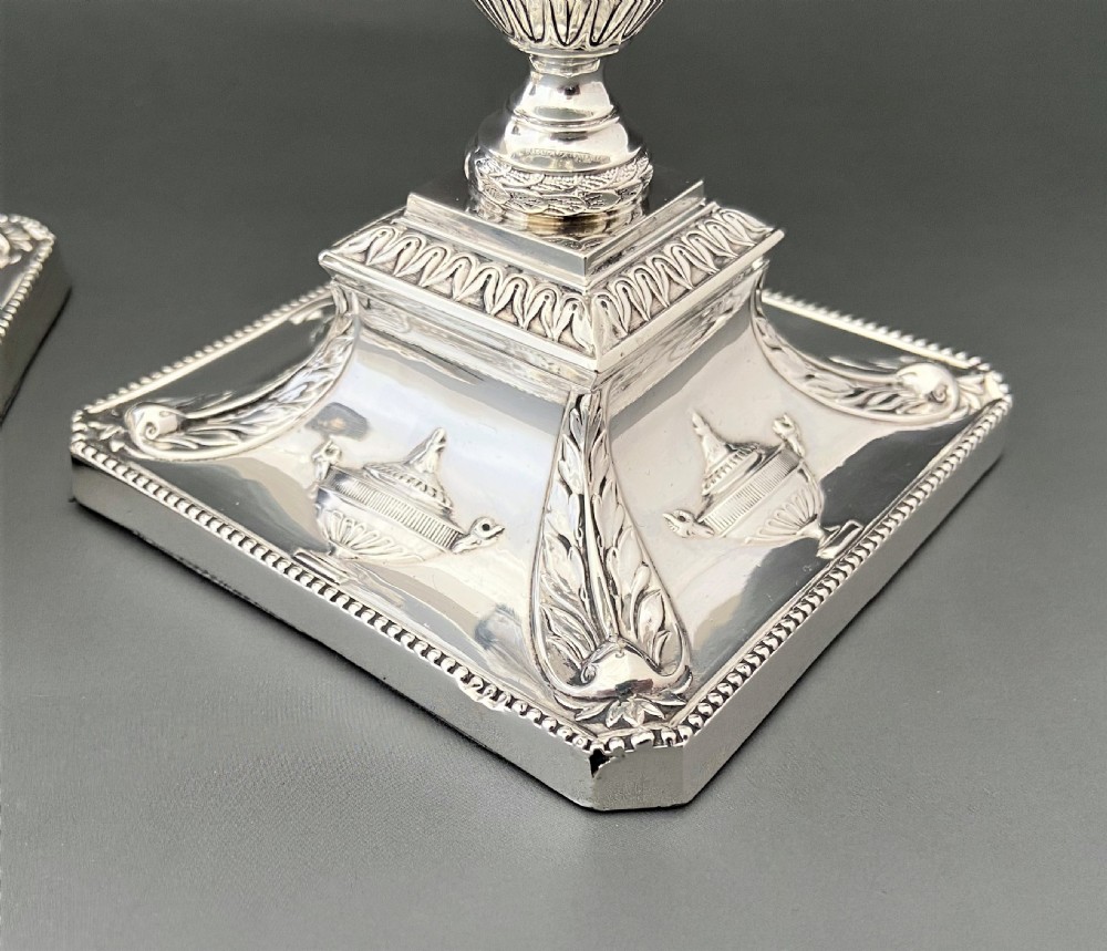 A superb pair of Edwardian silver candlesticks View VIII