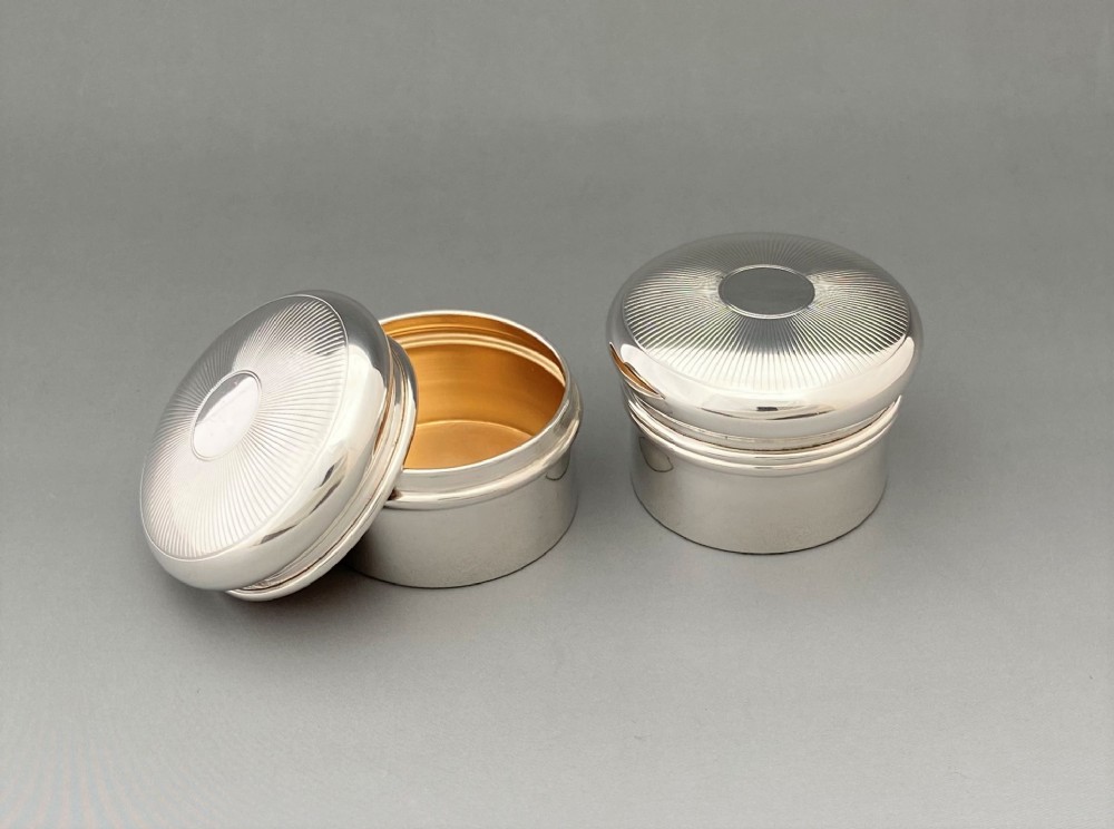 A rare pair of his 'n' hers silver gilt pill boxes