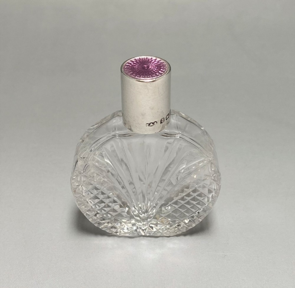 A Gorgeous Art Deco silver & enamel mounted scent bottle