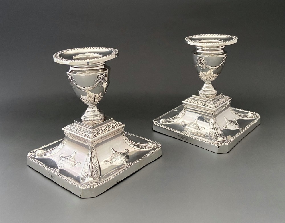 A superb pair of Edwardian silver candlesticks