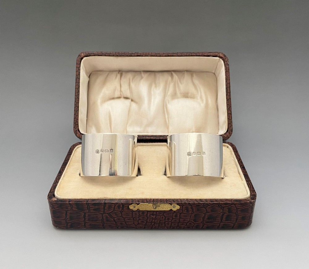 A substantial pair of boxed silver napkin rings