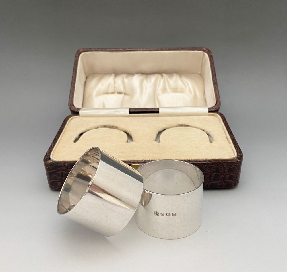 A substantial pair of boxed silver napkin rings View II
