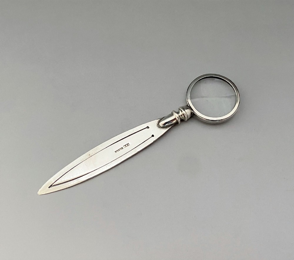 An unusual silver bookmark with magnifying glass terminal