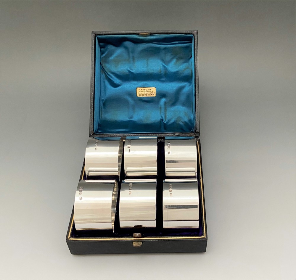 A rare set of 6 boxed Edwardian silver napkin rings