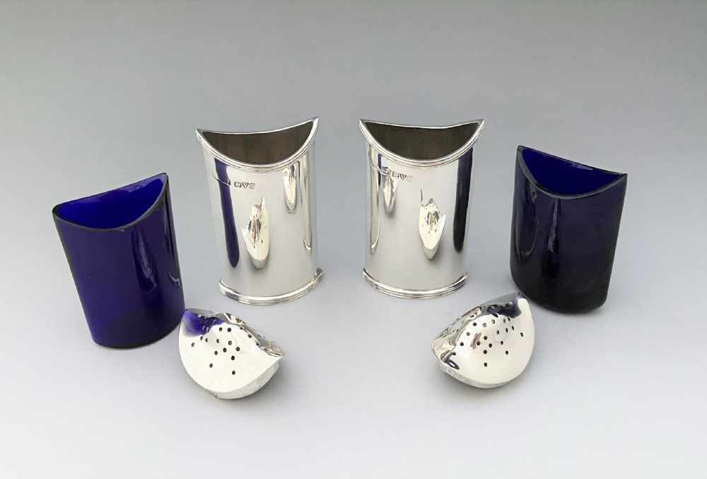 A stylish pair of Asprey & Co. Chester silver pepper pots View IV