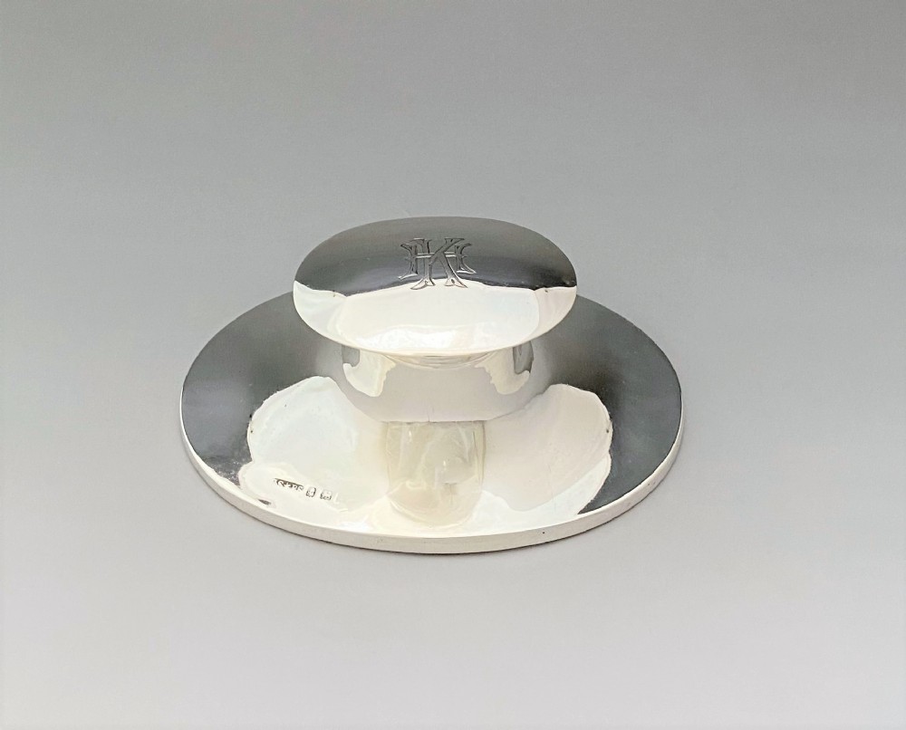 A stylish George V silver inkwell
