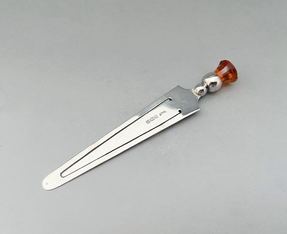 A charming thistle topped silver bookmark